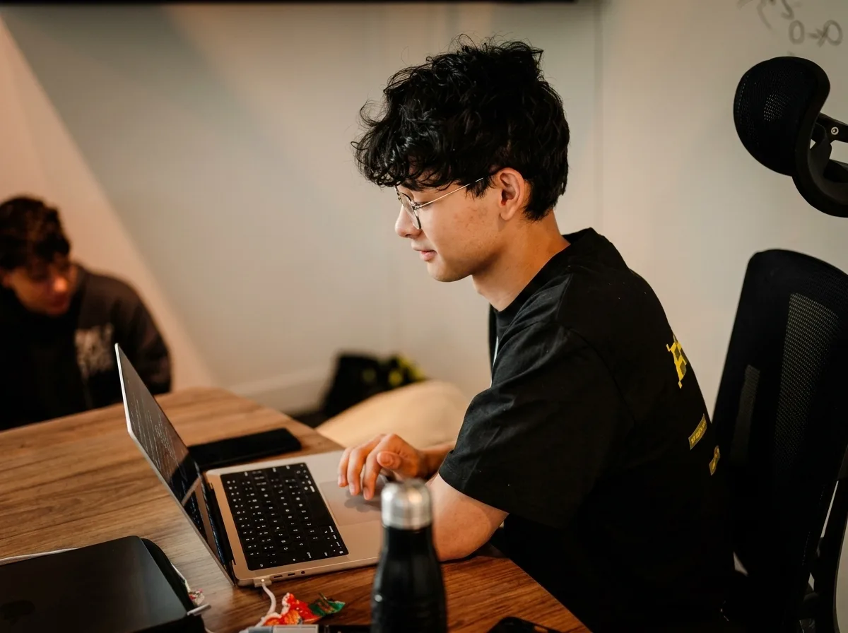 Freddy Bautista working on a laptop